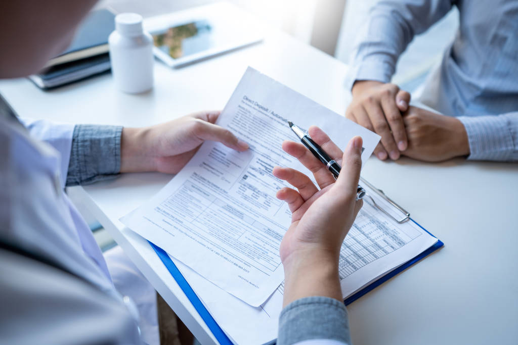 Nutritionist explaining and giving a consultation to a patient medical informations and diagnosis about the treatment for condition in hospital, medical ethics concept